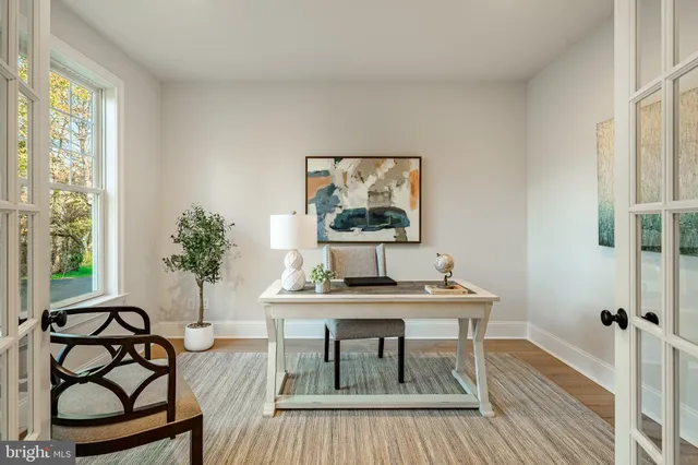 a bathroom with a granite countertop sink a toilet a mirror a vanity a shower and bathtub