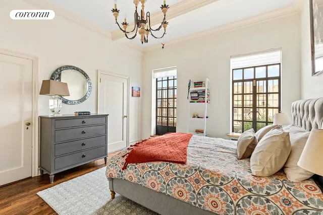 a bedroom with furniture and a window