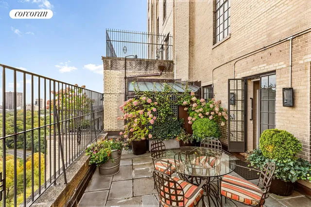 a balcony with furniture and lamp