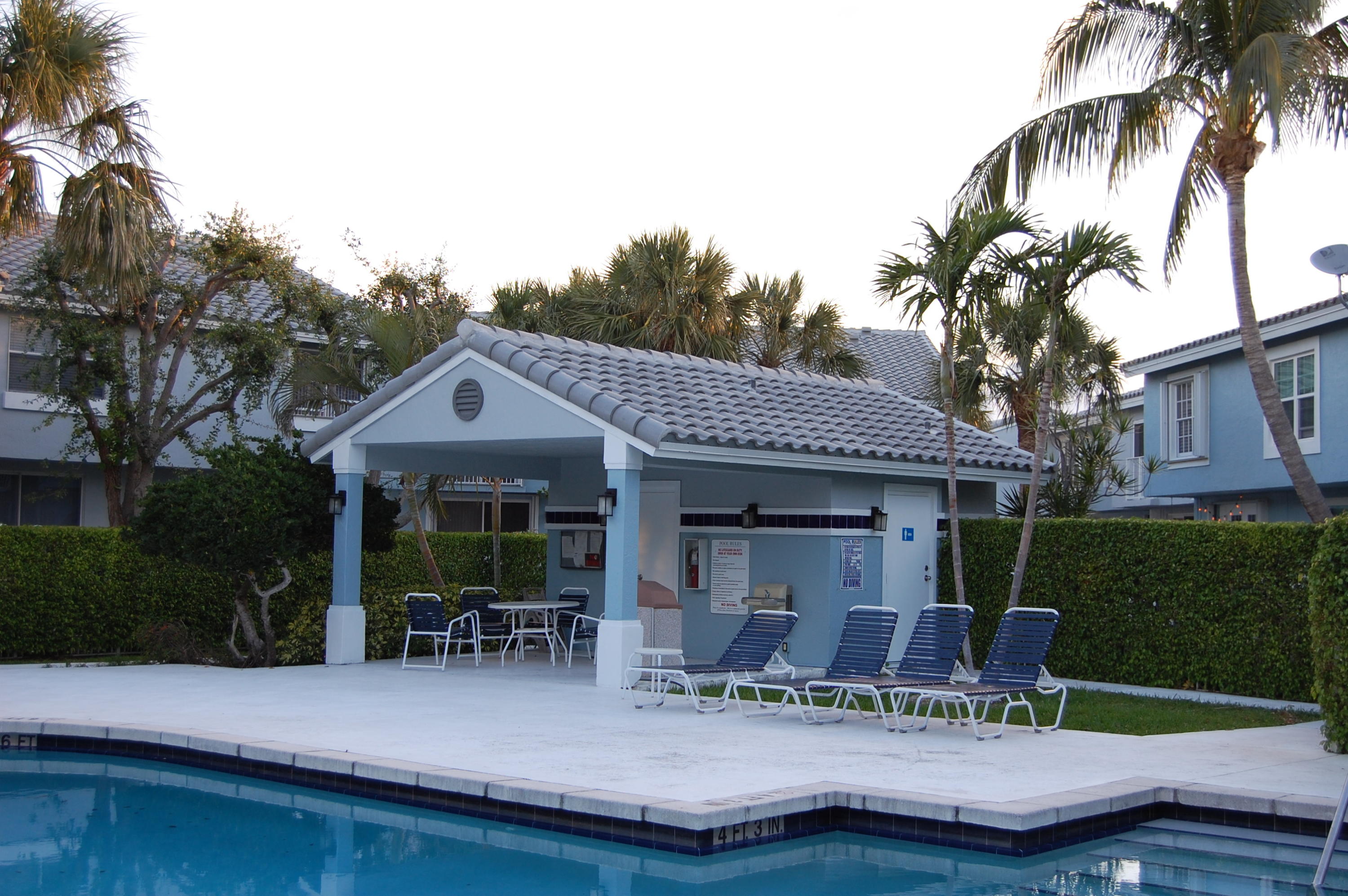 1072 Jeffery Street Boca Raton, FL 33487 - Photo 14 of 38 a house view with a seating space and garden