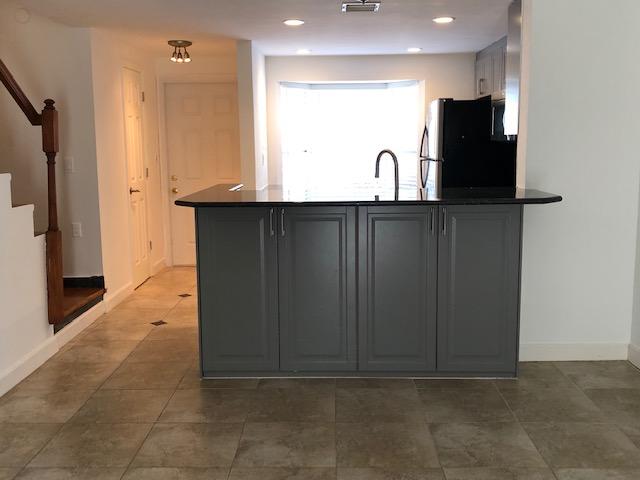 1072 Jeffery Street Boca Raton, FL 33487 - Photo 19 of 38 a view of a refrigerator in a kitchen