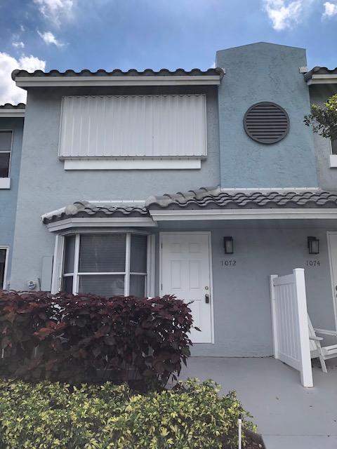 1072 Jeffery Street Boca Raton, FL 33487 - Photo 2 of 38 a house view with a garden space