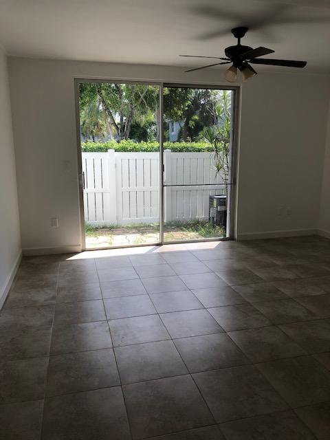1072 Jeffery Street Boca Raton, FL 33487 - Photo 23 of 38 a view of an empty room with wooden floor and a window