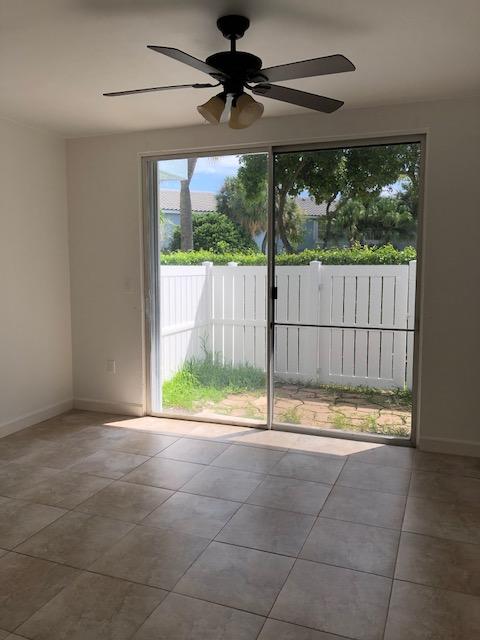 1072 Jeffery Street Boca Raton, FL 33487 - Photo 24 of 38 a view of empty room with floor to ceiling window and tree
