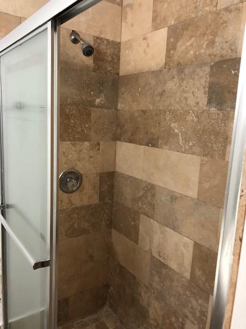 1072 Jeffery Street Boca Raton, FL 33487 - Photo 35 of 38 a bathroom with a shower
