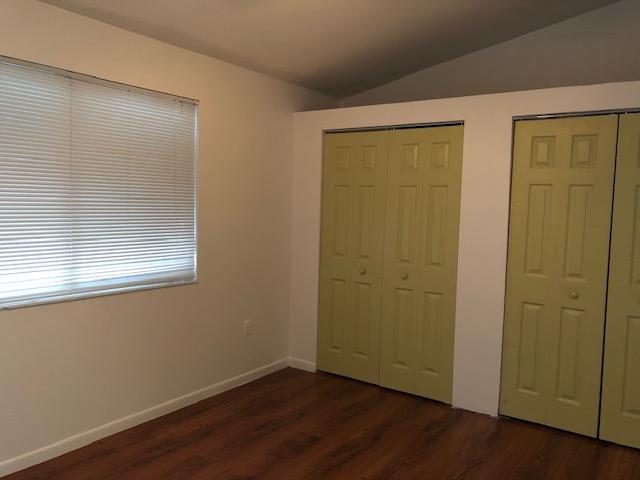 1072 Jeffery Street Boca Raton, FL 33487 - Photo 36 of 38 an empty room with wooden floor and windows