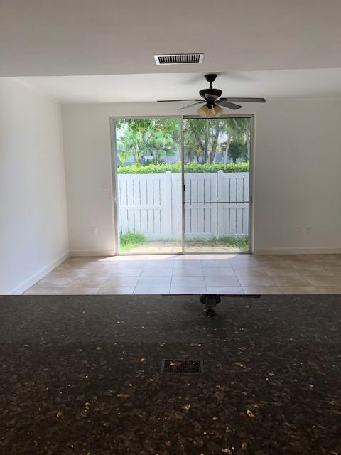 1072 Jeffery Street Boca Raton, FL 33487 - Photo 5 of 38 a view of an empty room with a window