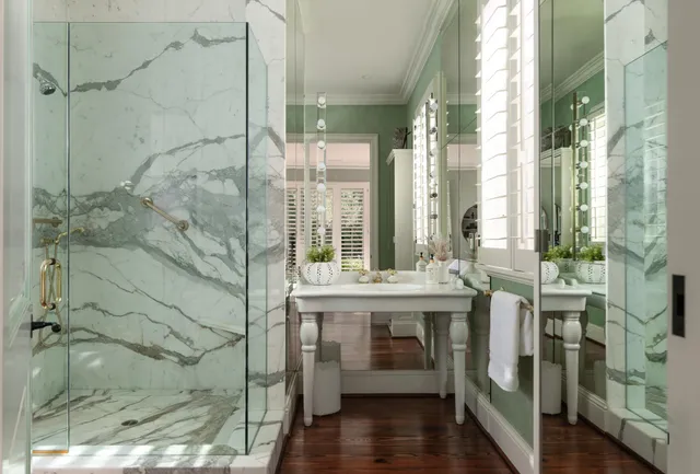 a bedroom with bed and a large window