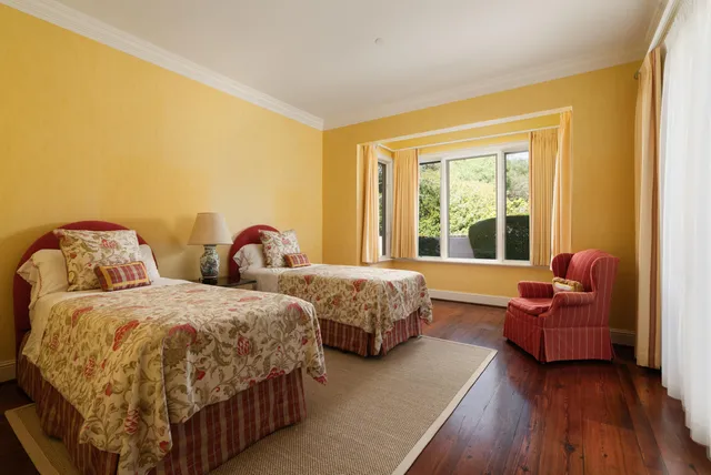 a front view of house with a garden