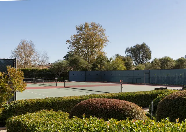 a front view of a house with a yard garage and outdoor seating
