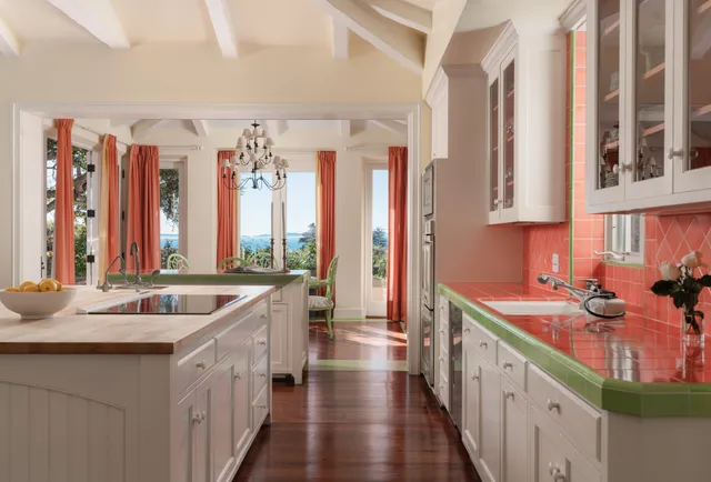 a kitchen with a sink and a large window