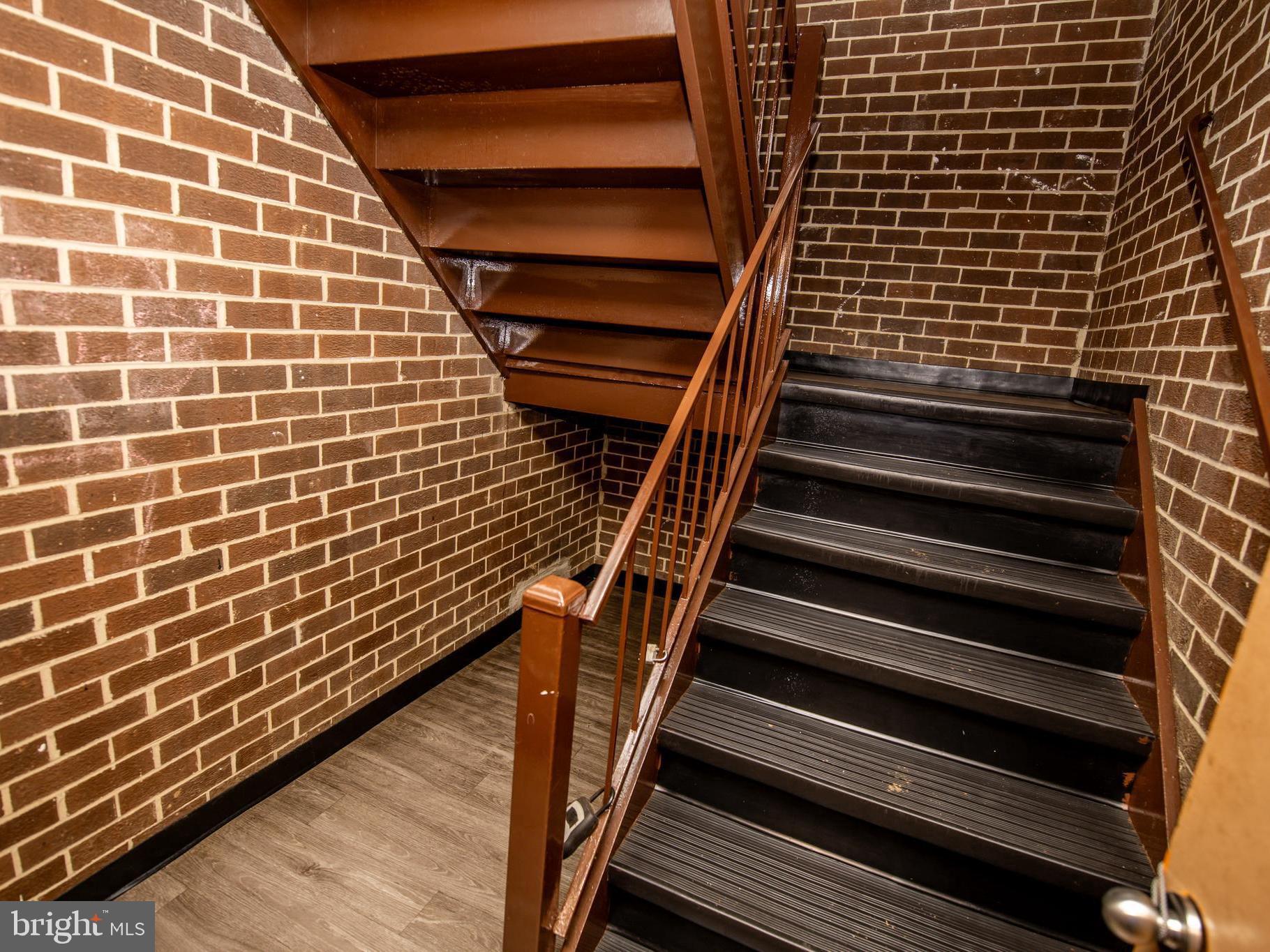 3934 Bel Pre Road, Unit 39342 Silver Spring, MD 20906 - Photo 26 of 30 a view of wooden staircase