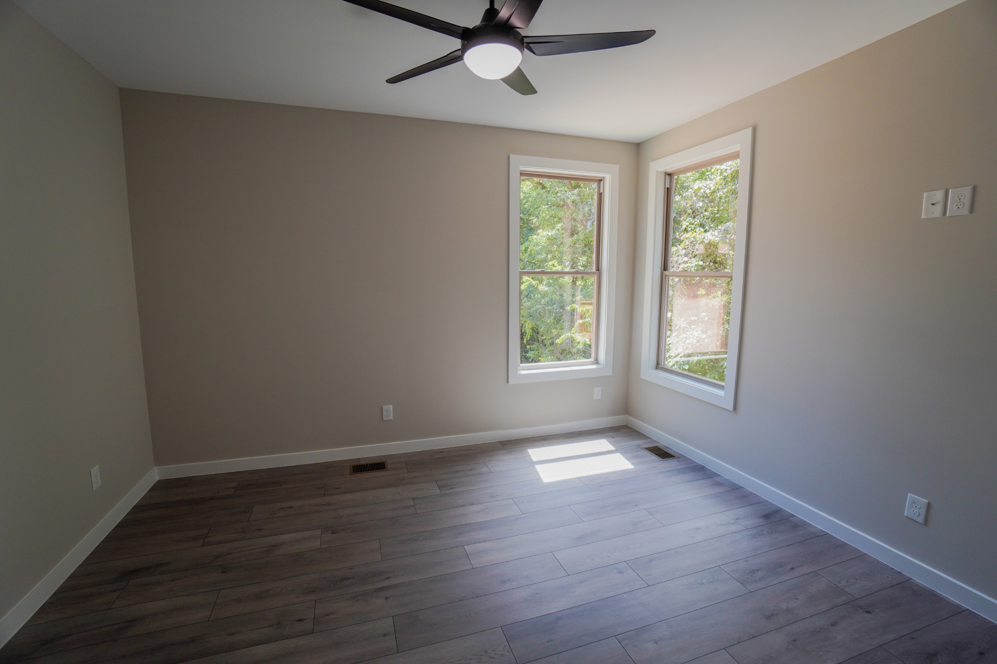 3001 Wixtown Road Westmoreland, TN 37186 - Photo 17 of 30 an empty room with wooden floor fan and windows