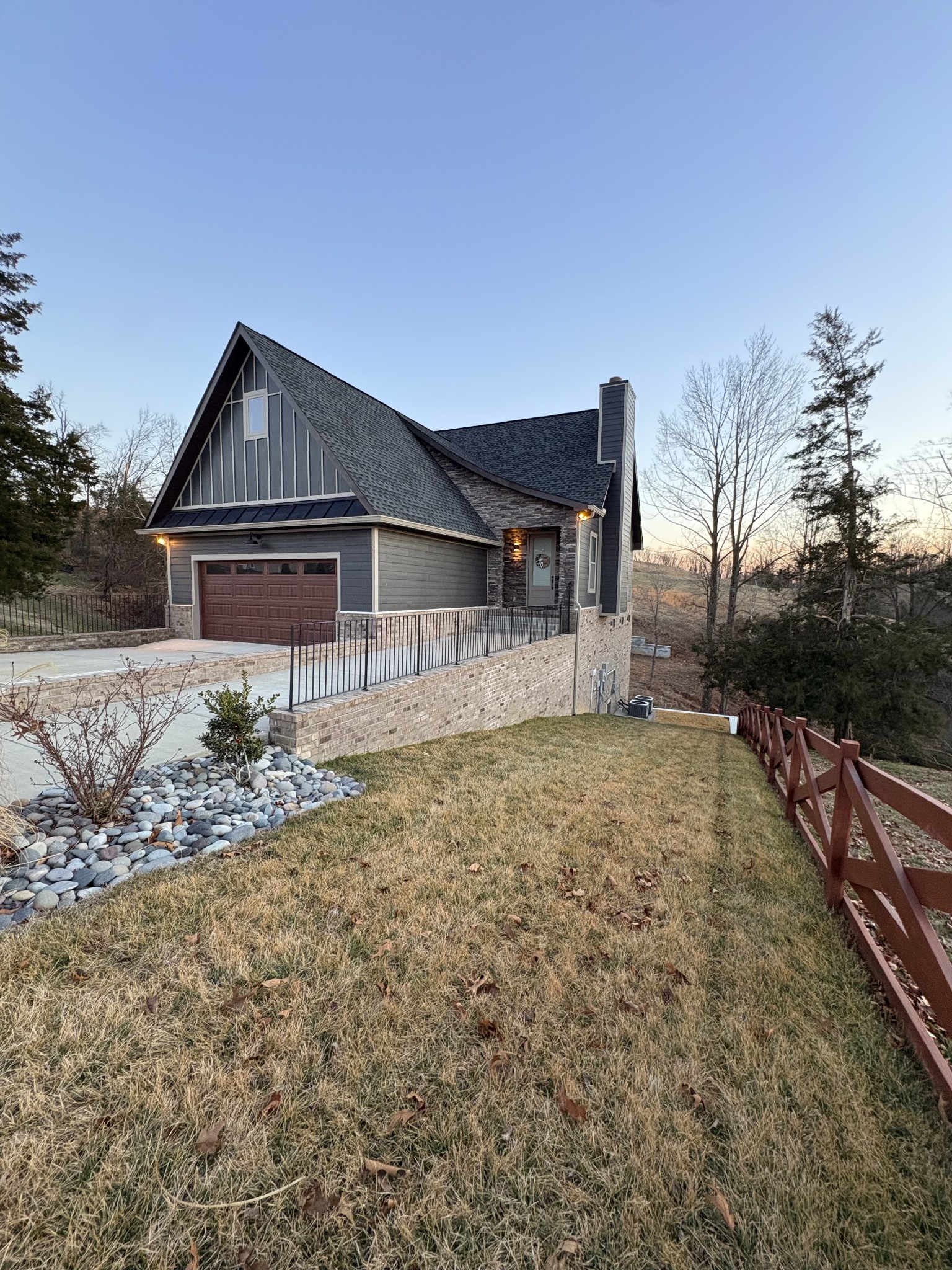 3001 Wixtown Road Westmoreland, TN 37186 - Photo 27 of 30 a house view with wooden fence and a bench