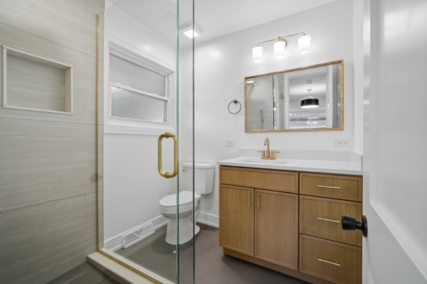 50 Glenview Road Glenview, IL 60025 - Photo 13 of 20 a bathroom with a toilet a sink and mirror