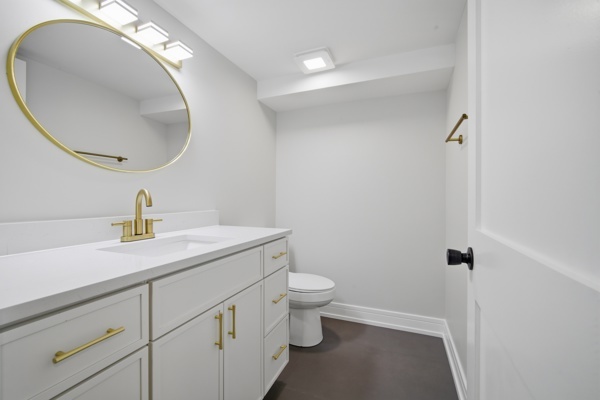 50 Glenview Road Glenview, IL 60025 - Photo 16 of 20 a bathroom with a sink a toilet and a mirror