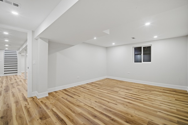 50 Glenview Road Glenview, IL 60025 - Photo 18 of 20 an empty room with wooden floor and windows