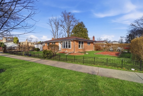50 Glenview Road Glenview, IL 60025 - Photo 2 of 20 a view of a house with a big yard plants and large trees