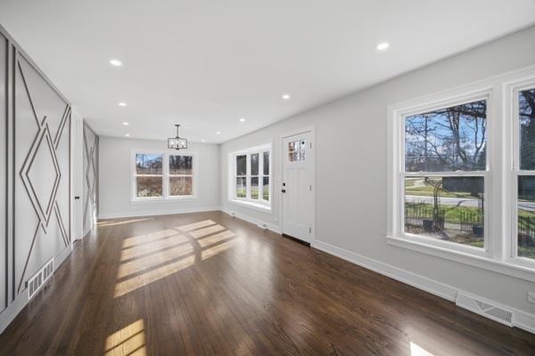 50 Glenview Road Glenview, IL 60025 - Photo 4 of 20 a view of an empty room with a window and wooden floor