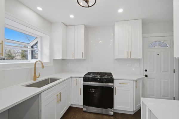 50 Glenview Road Glenview, IL 60025 - Photo 7 of 20 a kitchen with a sink and cabinets