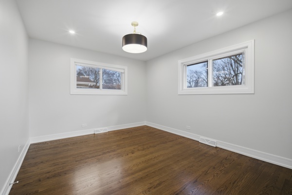 50 Glenview Road Glenview, IL 60025 - Photo 10 of 20 a view of an empty room with wooden floor and a window
