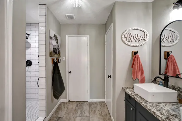 a bathroom with a sink and a mirror