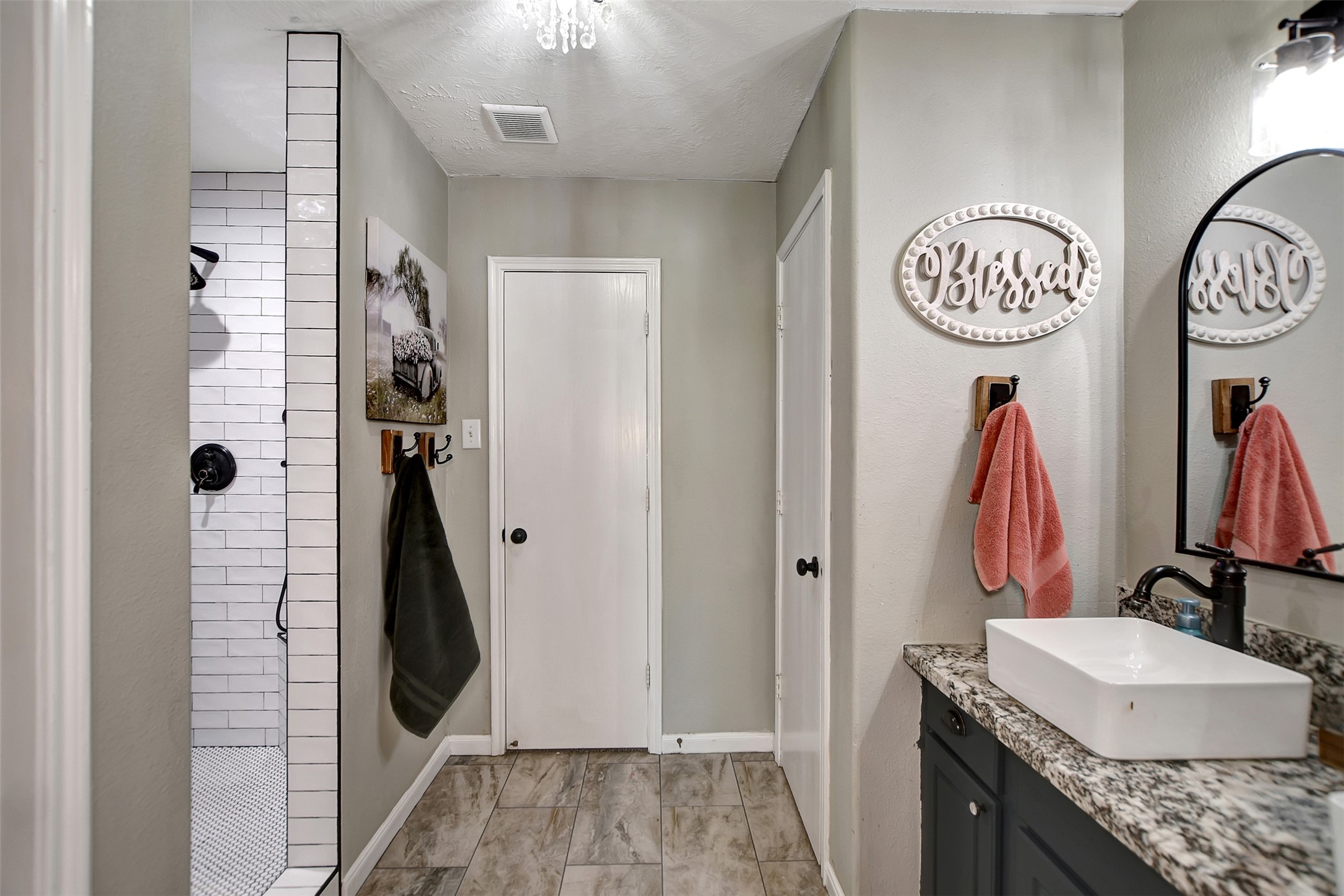 25401 Hunting Trail Magnolia, TX 77355 - Photo 23 of 50 a bathroom with a sink and a mirror