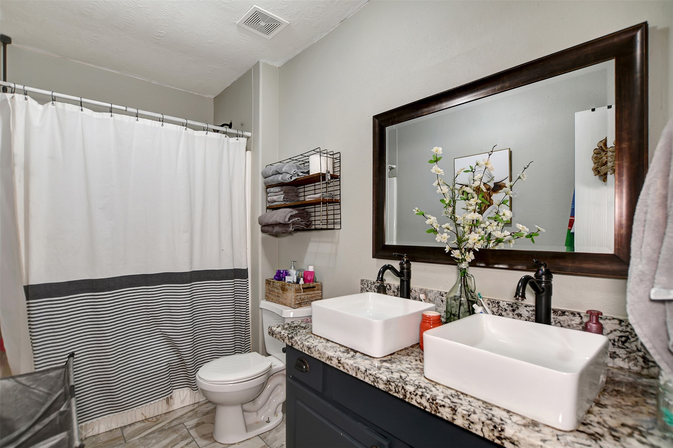 25401 Hunting Trail Magnolia, TX 77355 - Photo 32 of 50 a bathroom with a granite countertop toilet sink and mirror