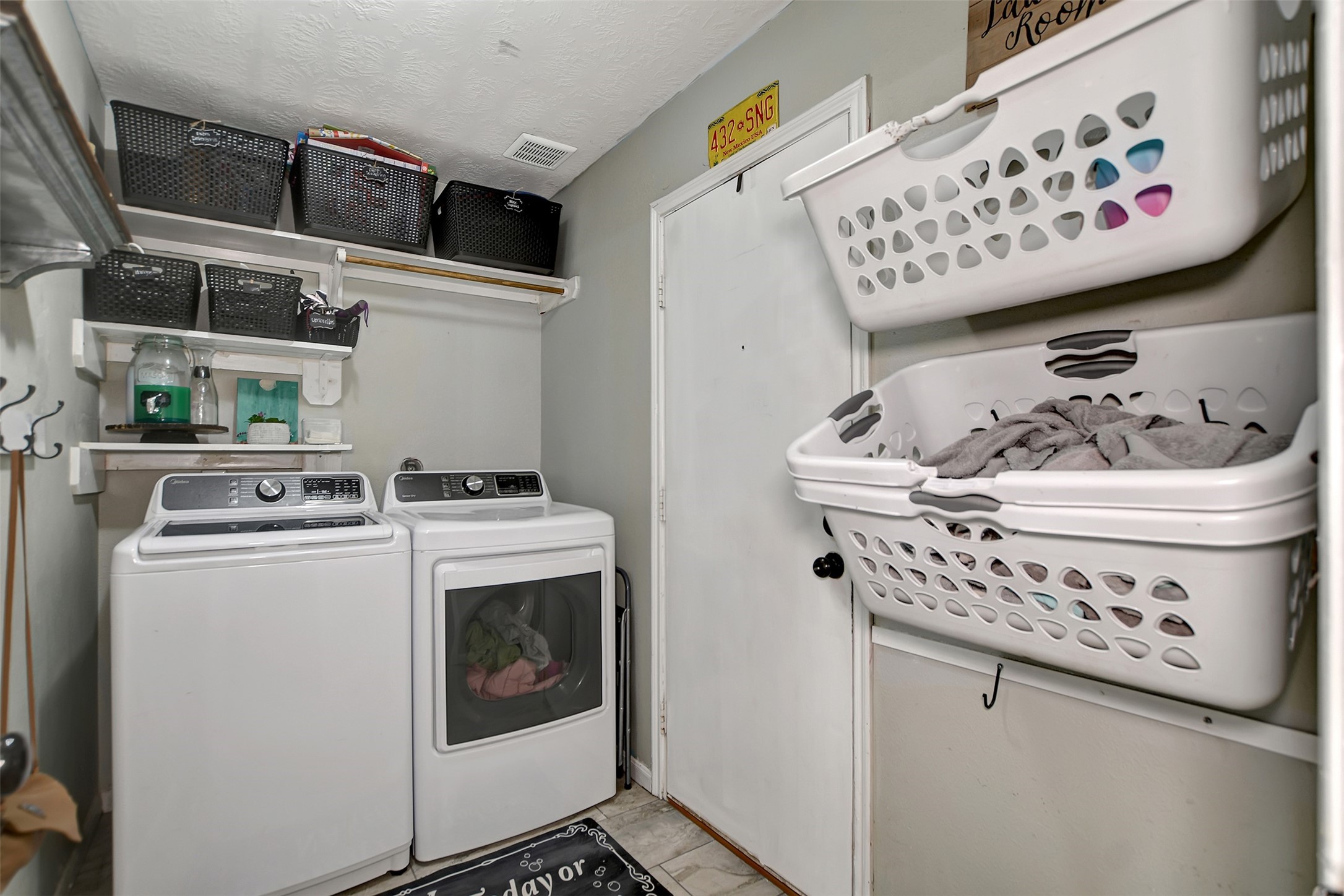 25401 Hunting Trail Magnolia, TX 77355 - Photo 33 of 50 a utility room with dryer and washer