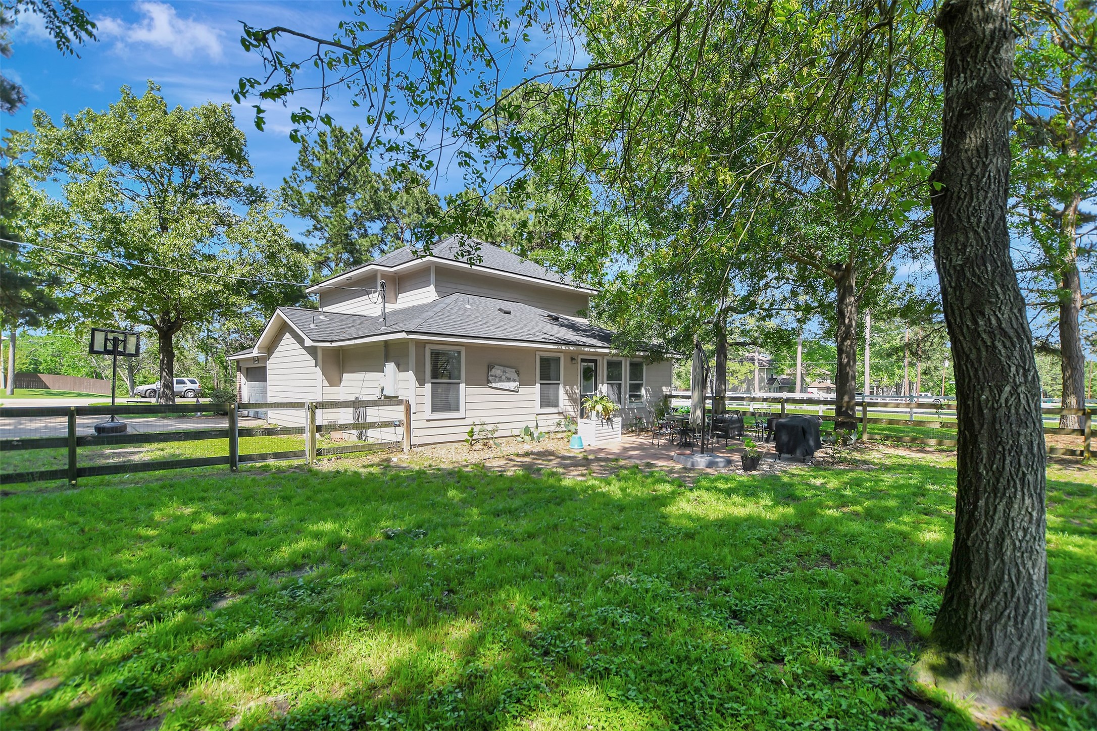 25401 Hunting Trail Magnolia, TX 77355 - Photo 34 of 50 a view of a house with a yard porch and sitting area