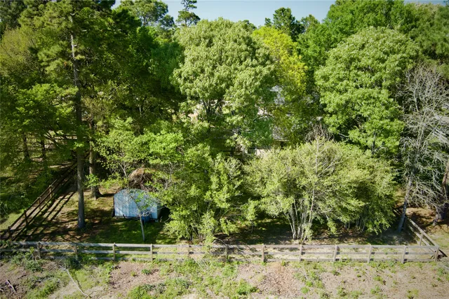 a backyard of a house with a yard and outdoor seating