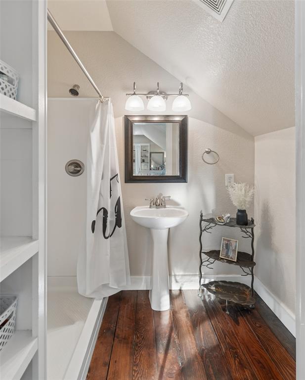 492 County Road 4387 Decatur, TX 76234 - Photo 23 of 40 a bathroom with a sink and a mirror