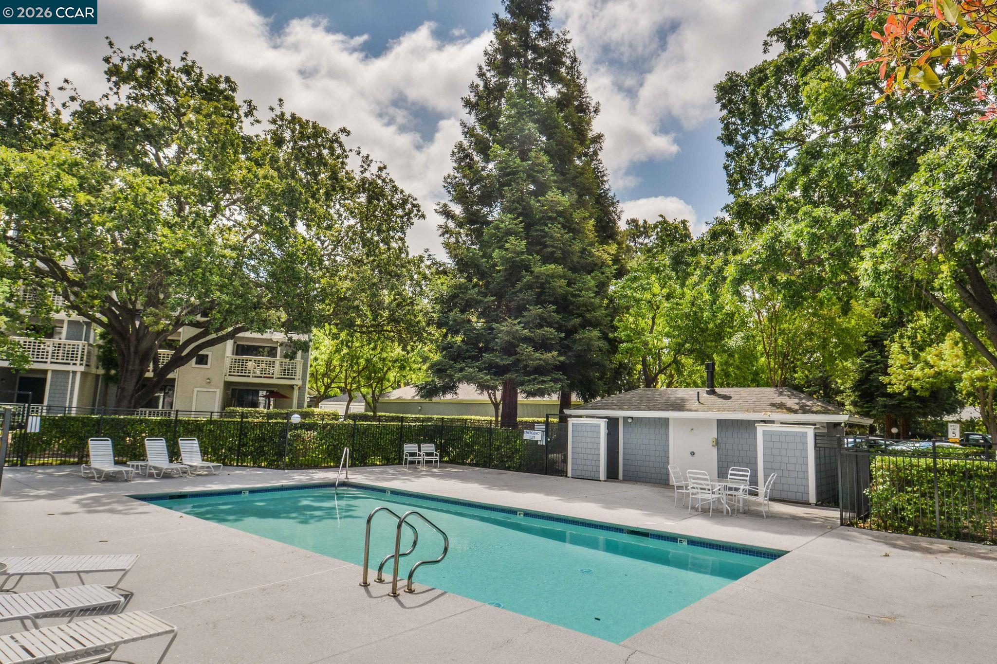 2586 Oak Road, Unit 130 Walnut Creek, CA 94597 - Photo 24 of 31 a house view with a sitting space and garden