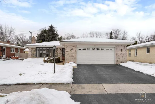 a view of a house with a snow in the background
