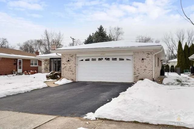a view of a house with a snow in the background