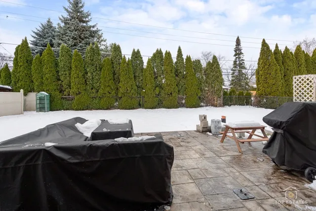 a terrace of a house with outdoor seating
