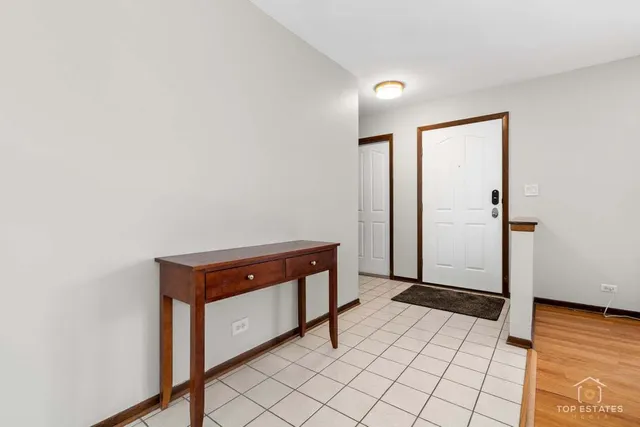 a room with a bench and vanity