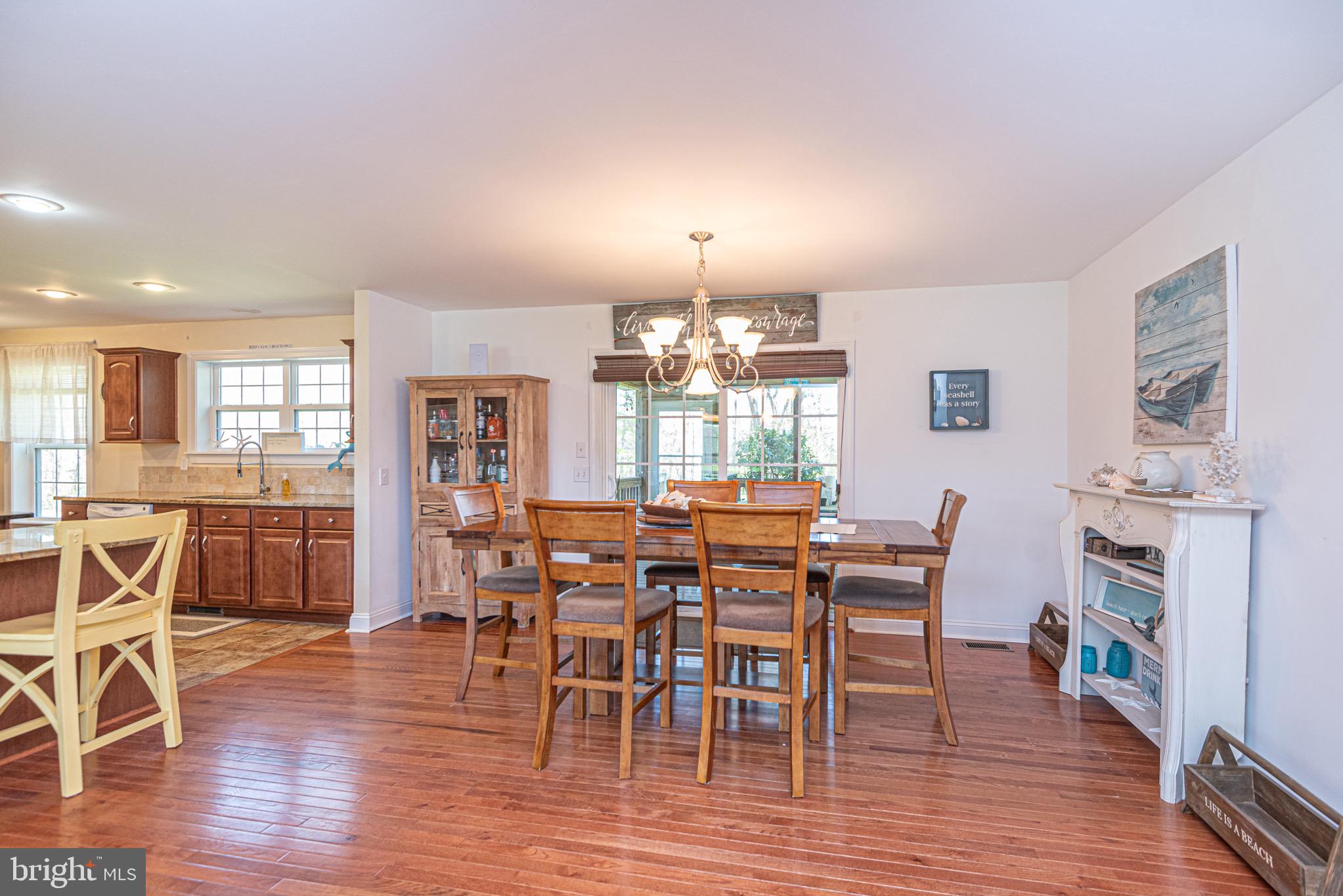 12740 Jarvis Road Bishopville, MD 21813 - Photo 18 of 47 a view of a dining room with furniture window and wooden floor