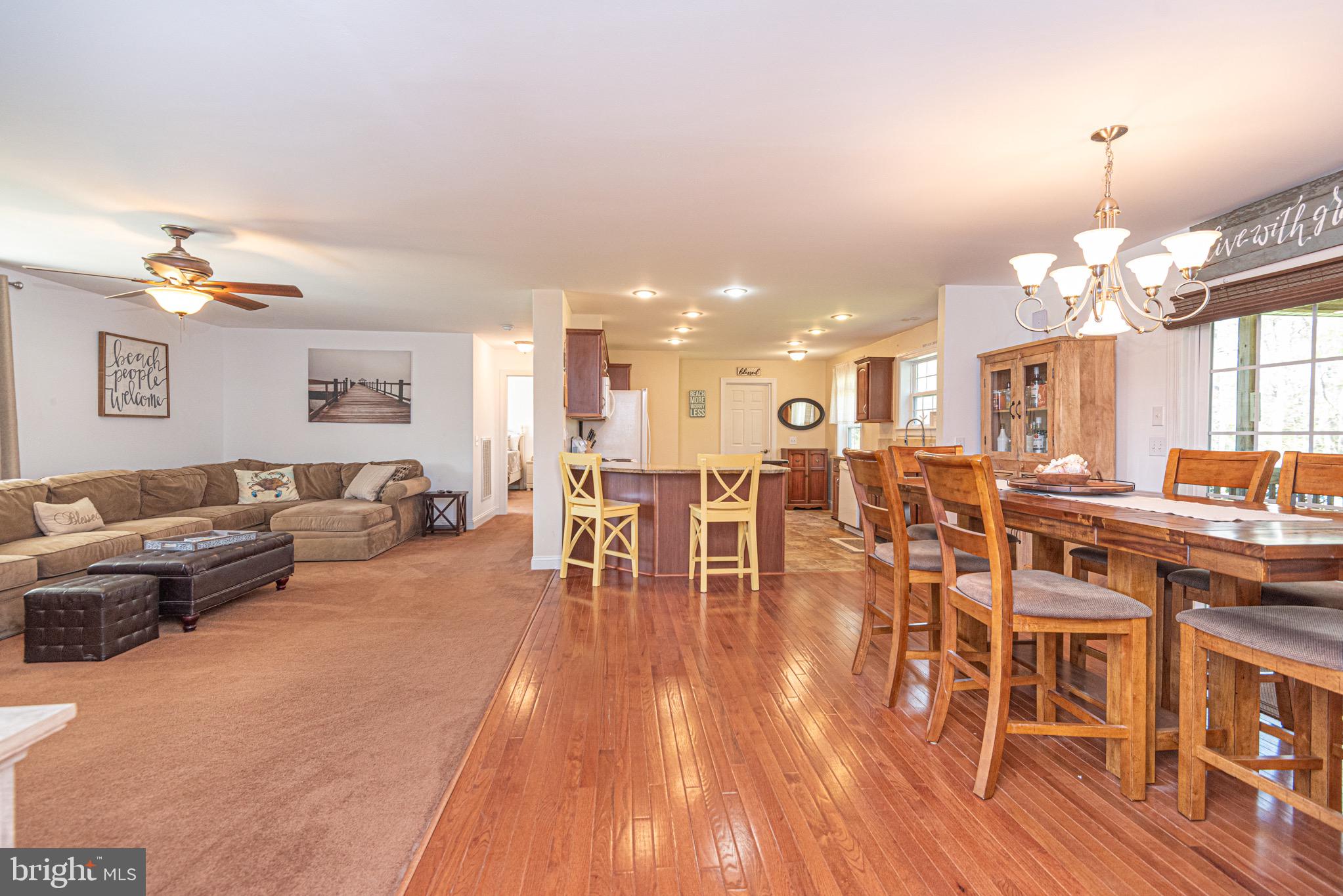 12740 Jarvis Road Bishopville, MD 21813 - Photo 21 of 47 a living room with lots of furniture and a wooden floor