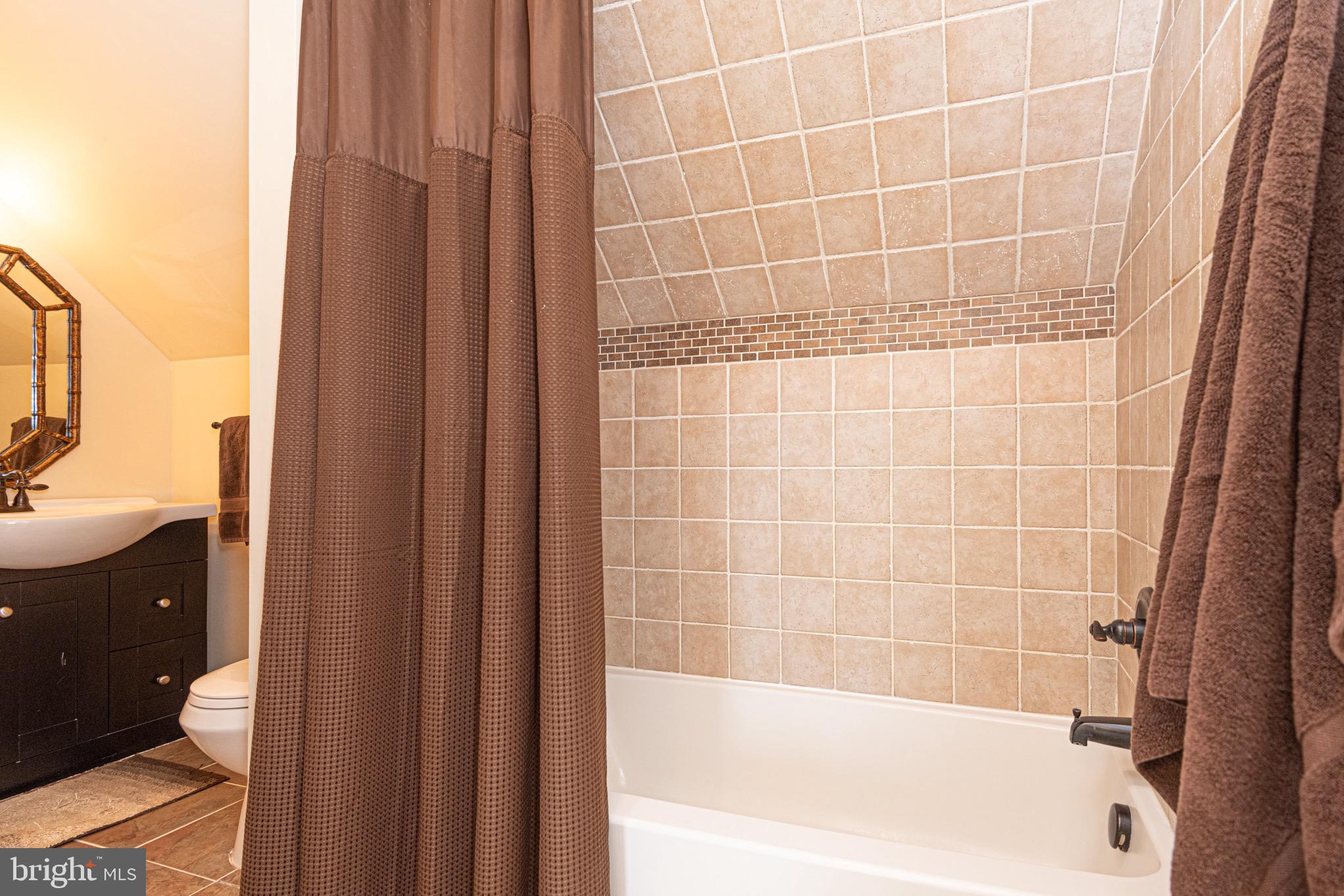 12740 Jarvis Road Bishopville, MD 21813 - Photo 39 of 47 a bathroom with a bathtub and a shower