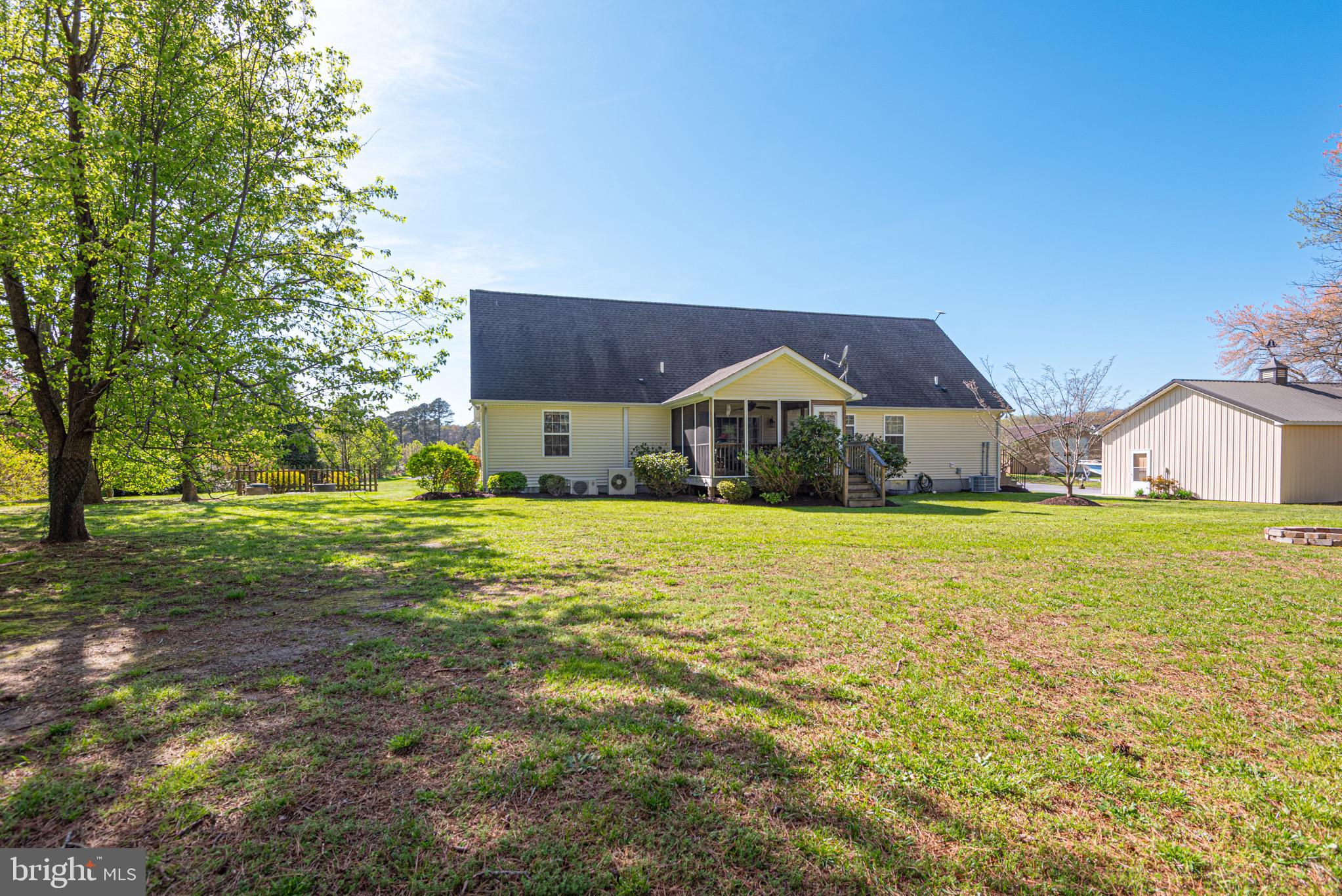 12740 Jarvis Road Bishopville, MD 21813 - Photo 8 of 47 a house view with swimming pool and trees in the background