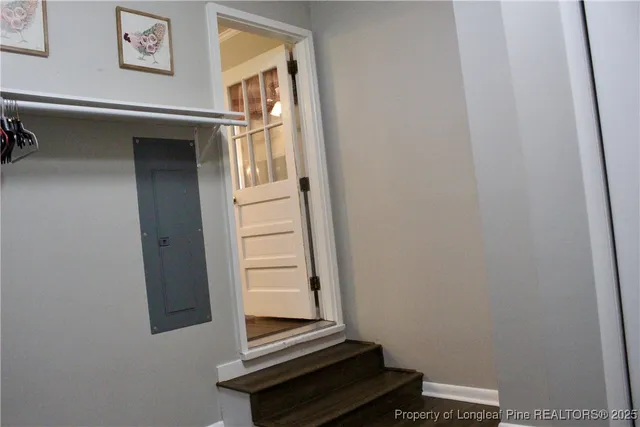 a close view of a utility room with dryer and washer