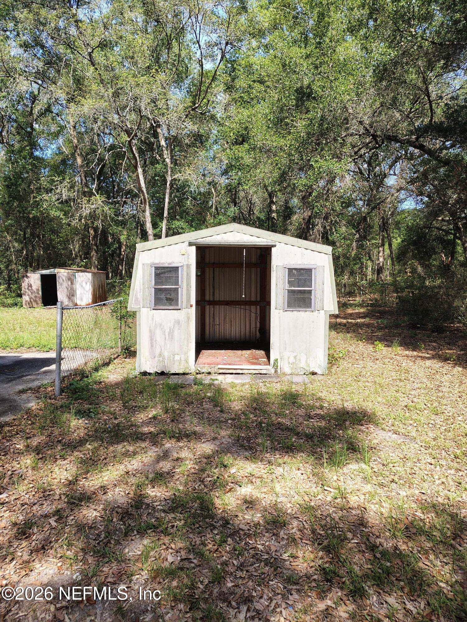 7202 Notre Dame Street Keystone Heights, FL 32656 - Photo 7 of 16 a front view of a house with a yard and garage