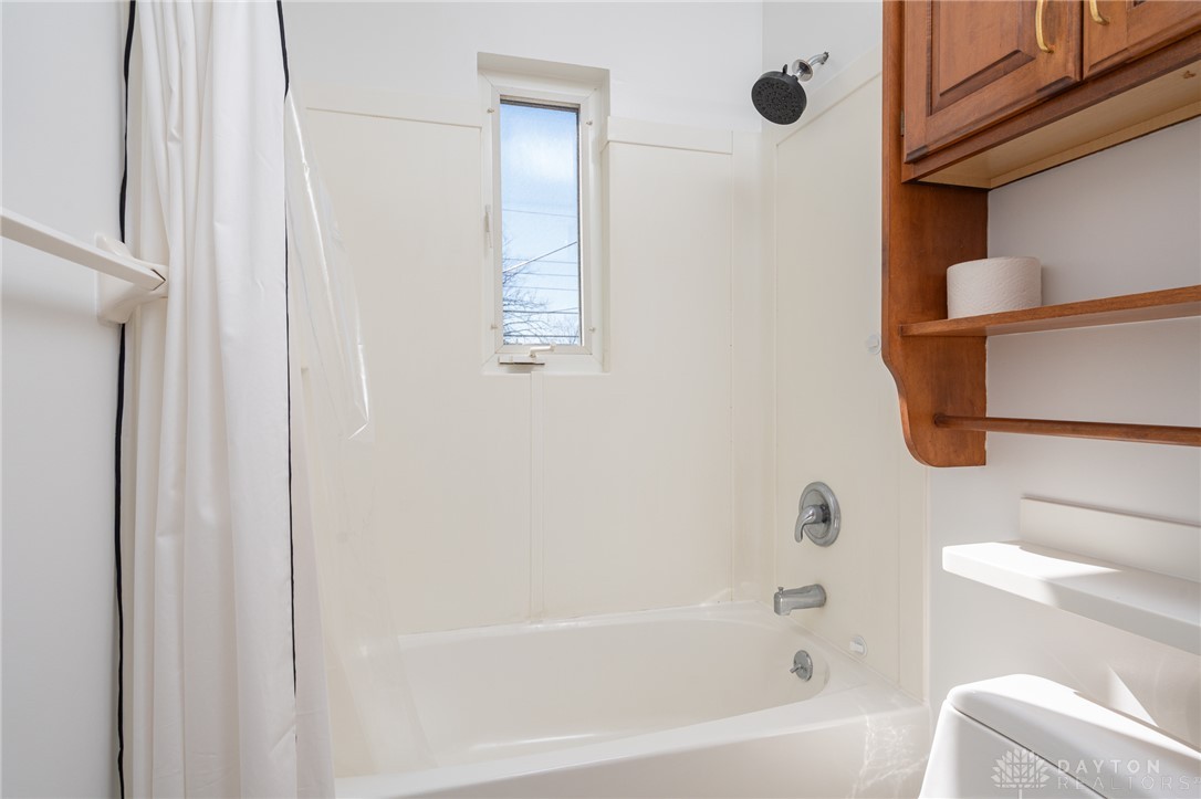 326 North Bromfield Road Kettering, OH 45429 - Photo 17 of 30 This clean bathroom features a convenient shower-tub combination and a small window for natural light.