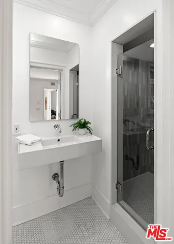 a bathroom with a sink and a mirror