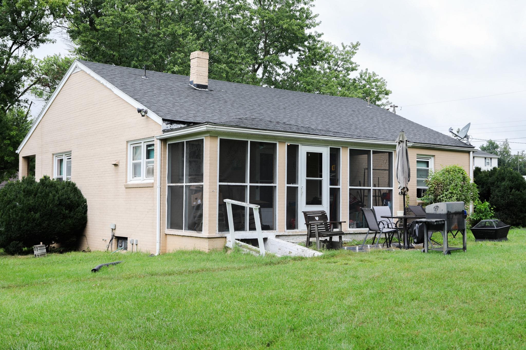 44 Stuart Avenue Stuarts Draft, VA 24477 - Photo 16 of 19 a view of a house with backyard sitting area and garden