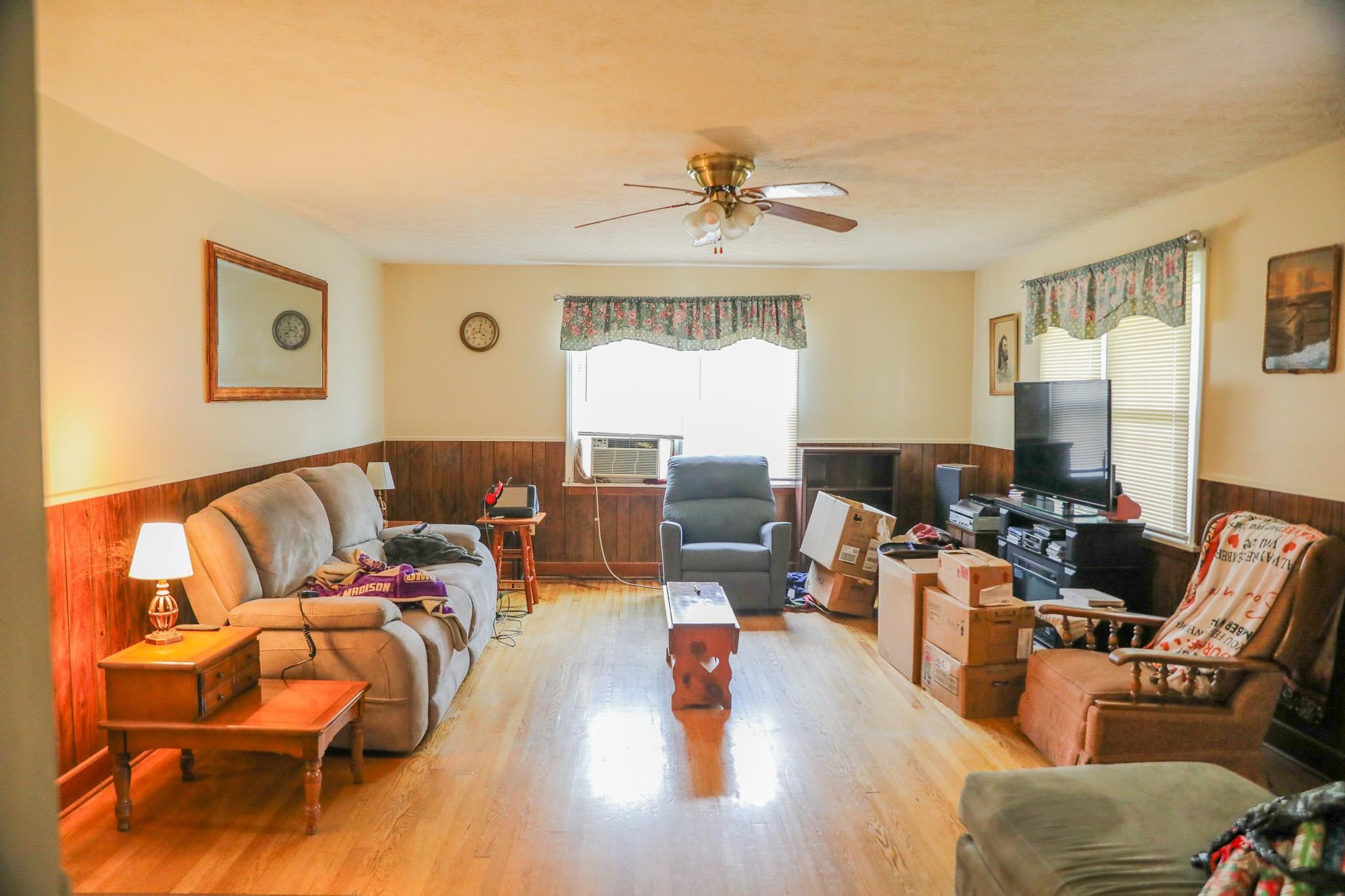 44 Stuart Avenue Stuarts Draft, VA 24477 - Photo 5 of 19 a living room with furniture or couch and a chandelier