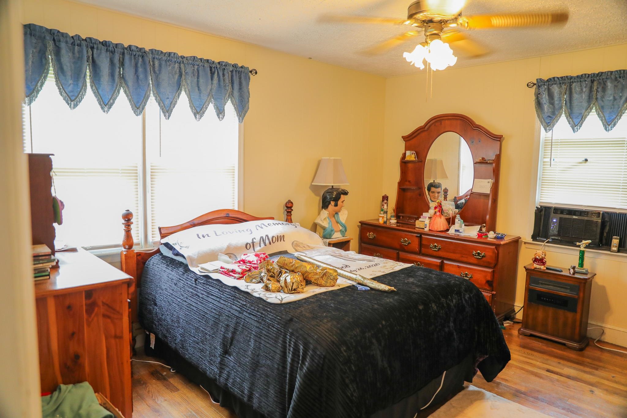 44 Stuart Avenue Stuarts Draft, VA 24477 - Photo 9 of 19 a bedroom with bed and a chandelier