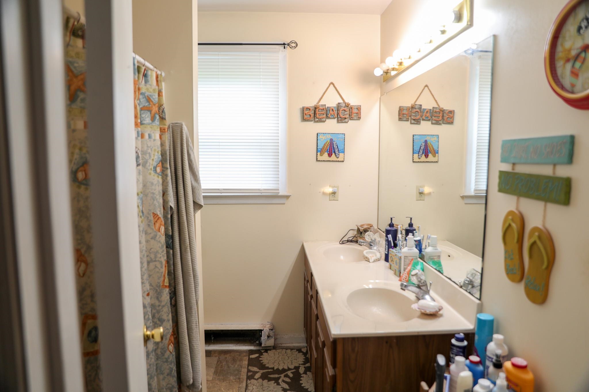 44 Stuart Avenue Stuarts Draft, VA 24477 - Photo 10 of 19 a bathroom with a sink and a mirror