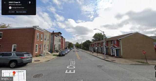 1604 East Chase Street Baltimore, MD 21213 - Photo 6 of 8 a view of a street with cars